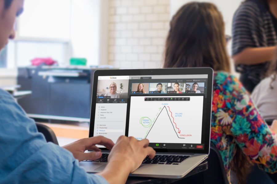 young-male-student-using-a-macbook-pro-during-class-mockup-a4642-900x600