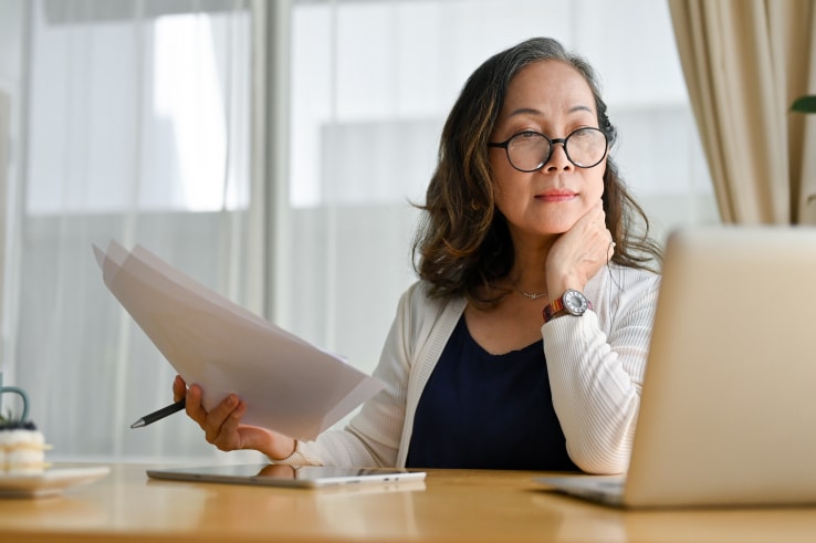 woman using a laptop participating in an online training